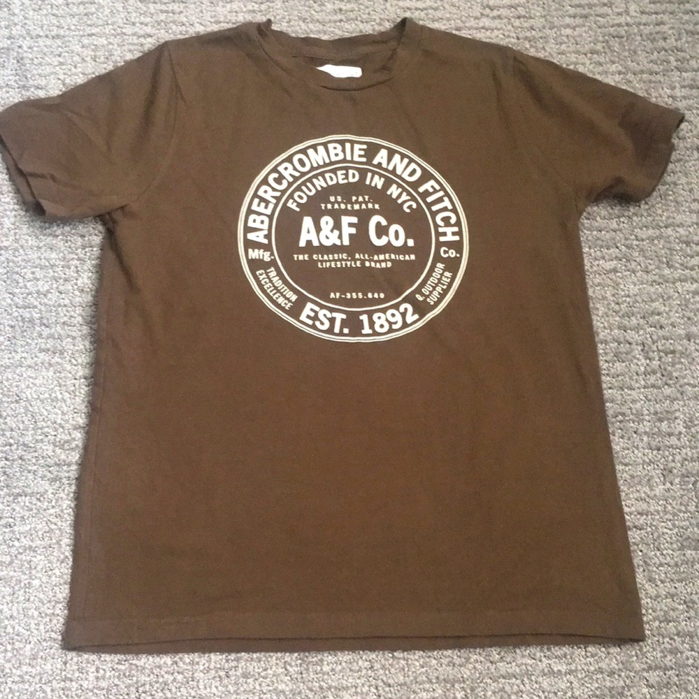 Brown shirt with a white design
